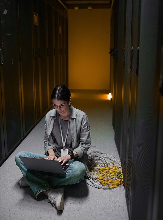 Cybersecurity professional working in server room